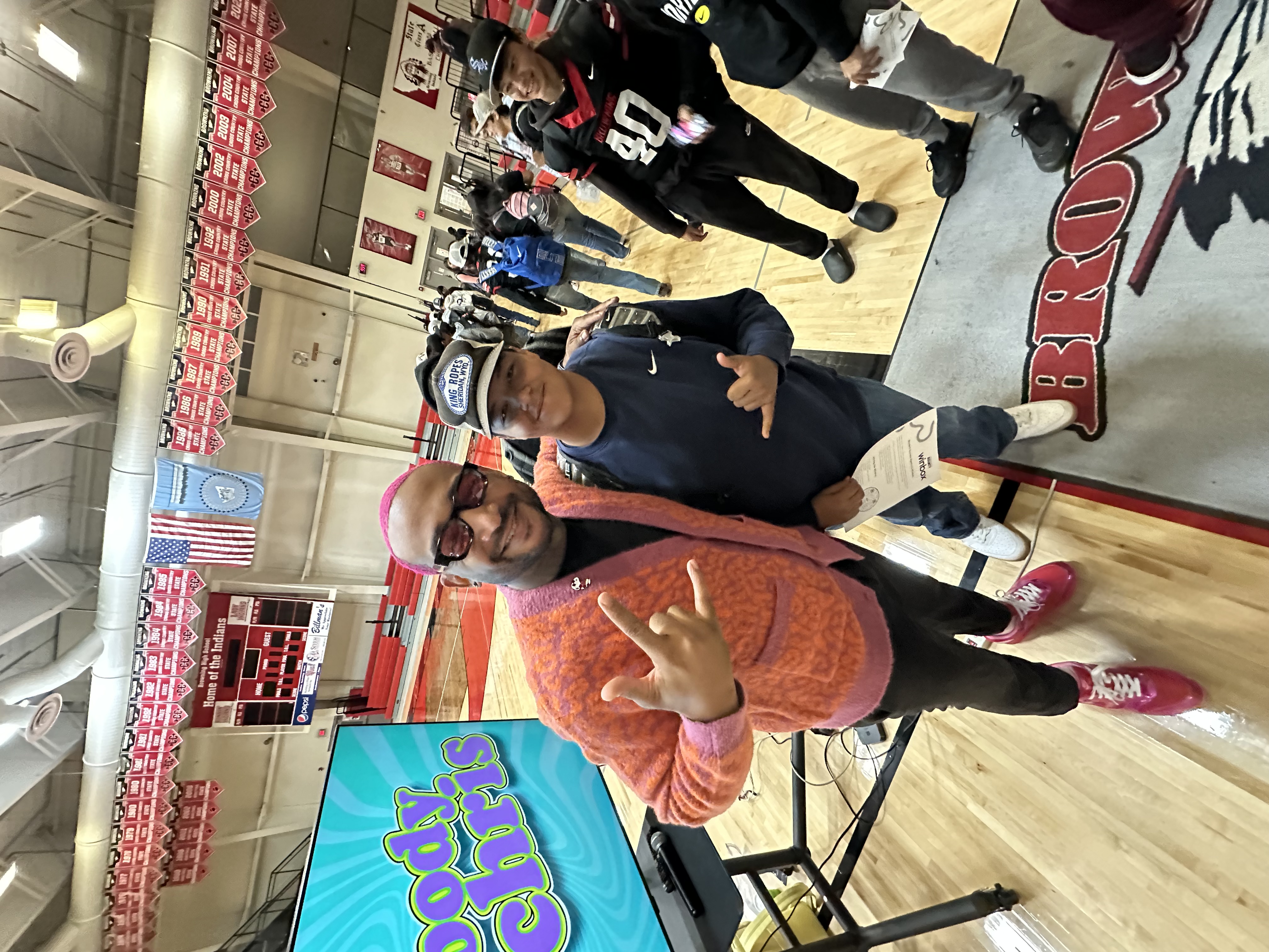 Chris with student at gym